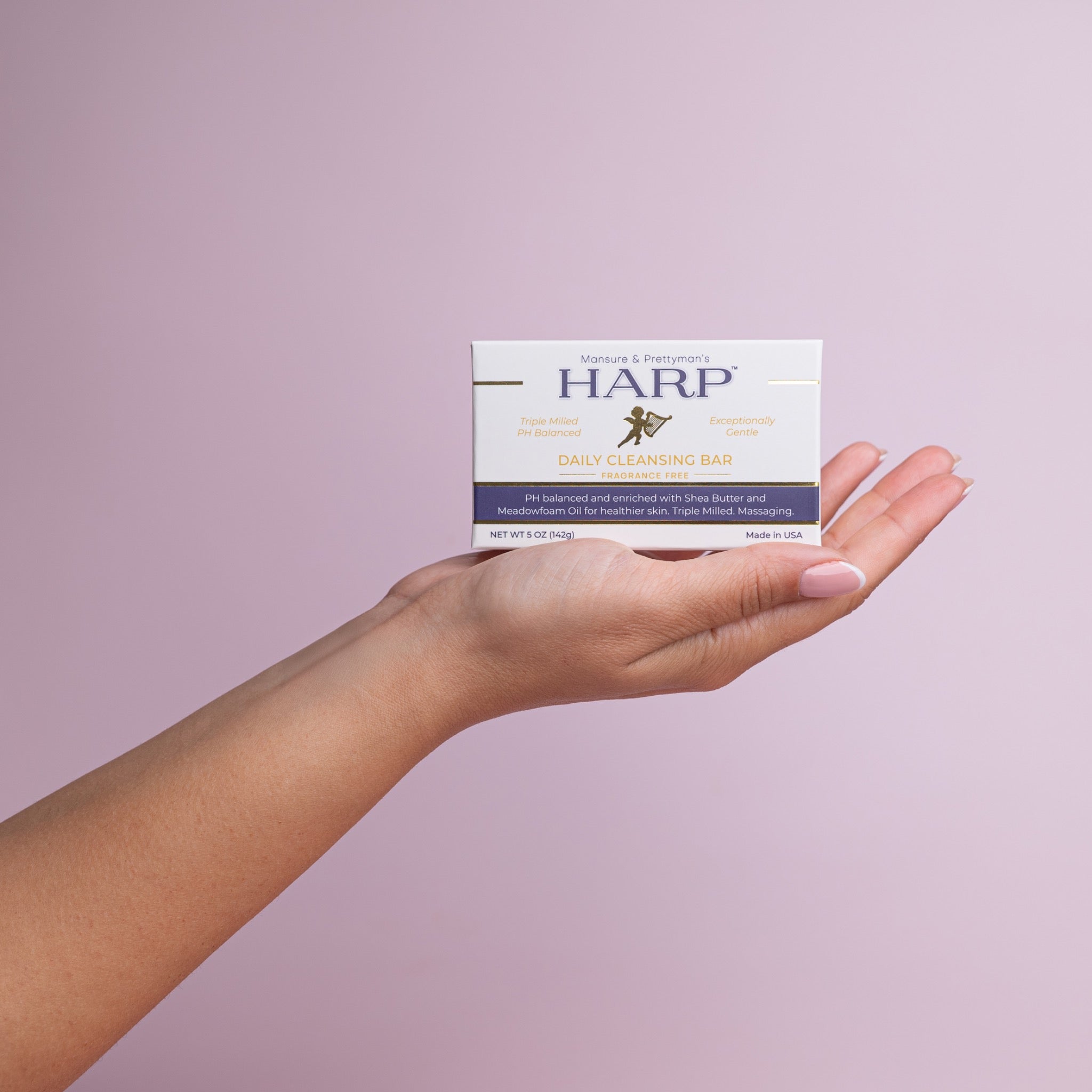 HARP fragrance-free daily cleansing bar held in hand